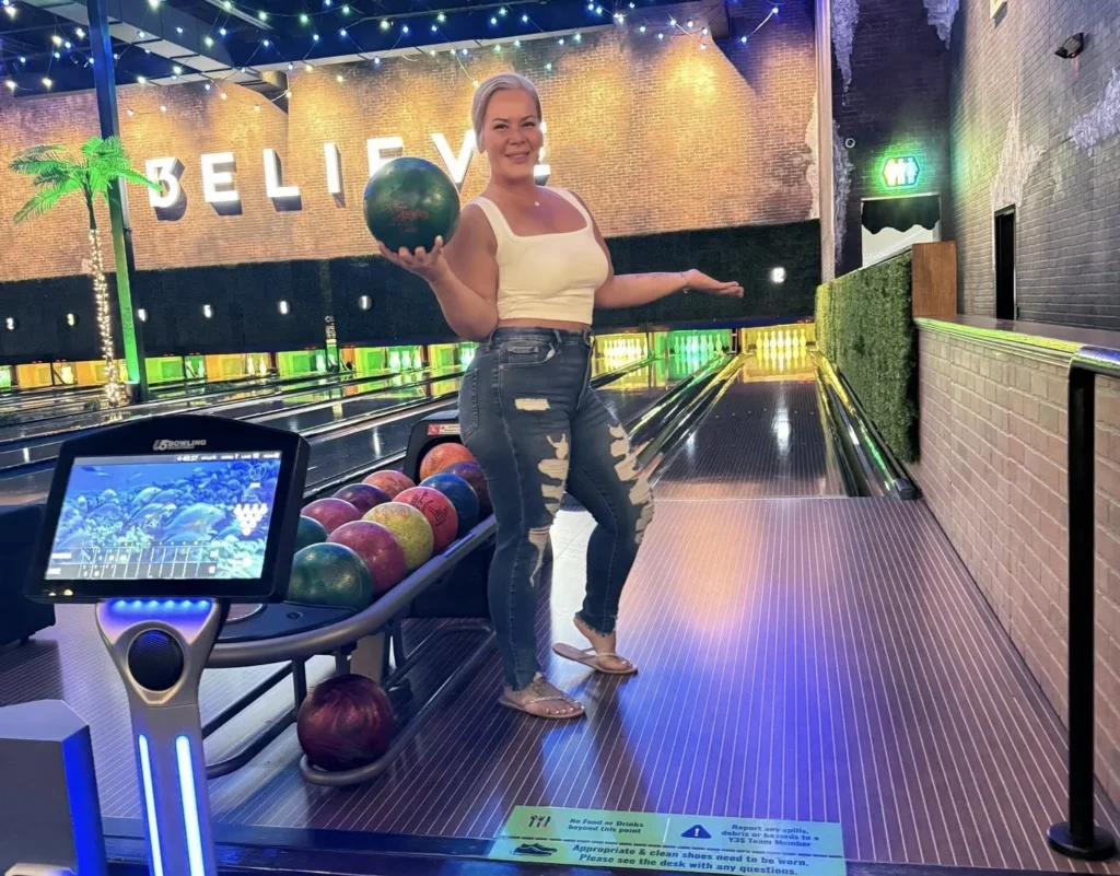 Amie holding bowling ball